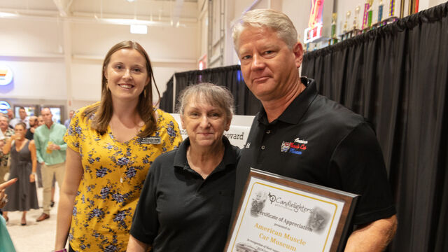 Candlelighters of Brevard present the American Muscle Car Museum with a plaque