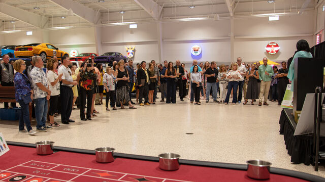 Gathering for plaques at the Candlelighters of Brevard Cars and Casino Night