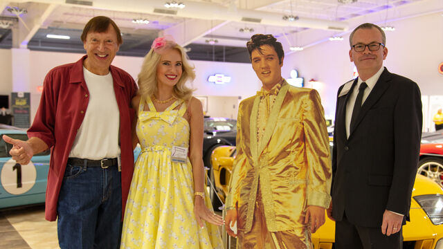 Mark, his wife, and Elvis take a photo together with another man