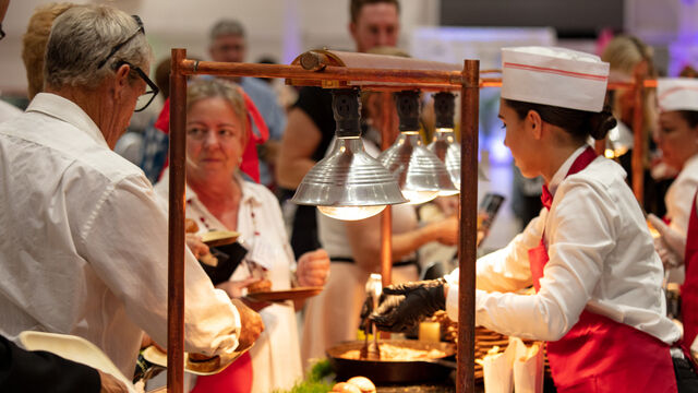 Attendees get some food at the Health First 35th Celebration of Giving Event