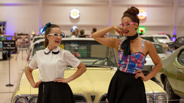 Two women at the Health First 35th Celebration of Giving Event in glasses and skirts