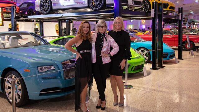 Posing with some of the cars at the Health First 35th Celebration of Giving Event