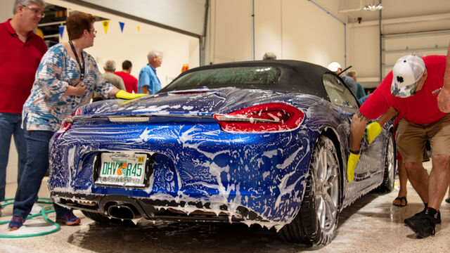 Proper car washing techniques are demonstrated