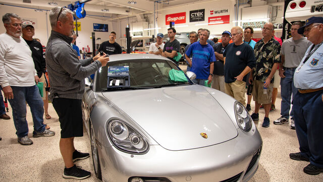Demonstrating proper techniques and products on the Porsche