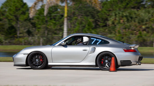 Silver Porsche number 77