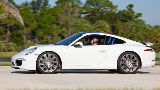 White Porsche driving