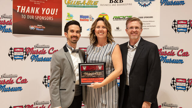 Coastal Vision Care receiving a plaque for sponsoring