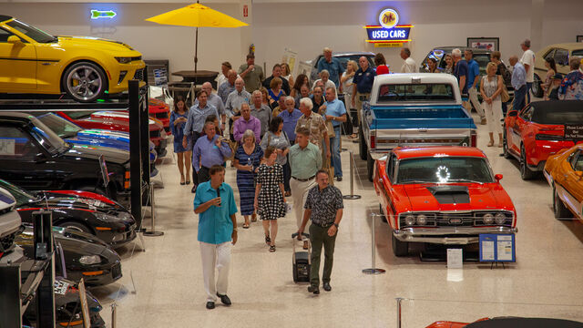 Checking out the many cars and trucks at the Space Coast Honor Flight Event