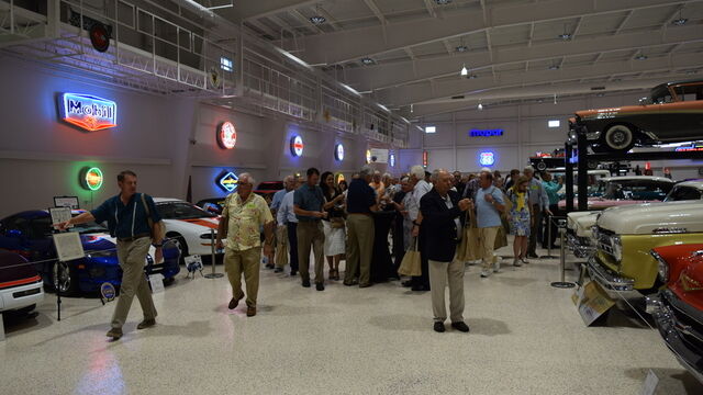 Touring the exotic and vintage cars on display at the Space Coast Honor Flight Event