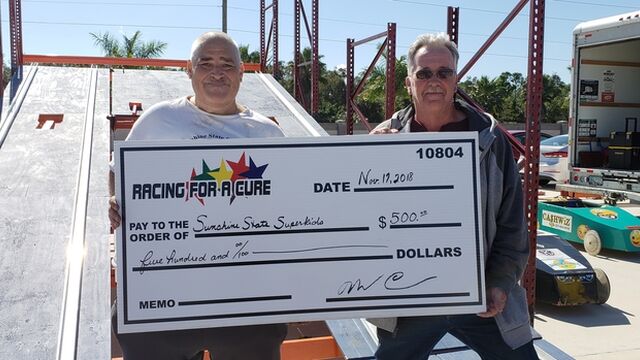Sunshine State Superkids is presented with a check for $500