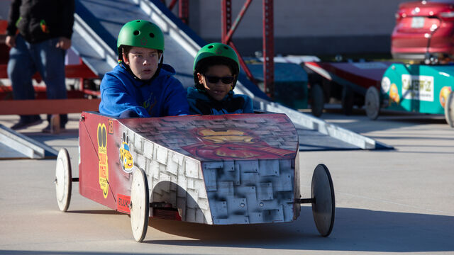 Two kids at the Sunshine State Superkids soapbox derby hit some turbulence on their way to the finish line