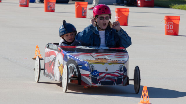 Cheering as they approach the finish line at Sunshine State Superkids soap derby