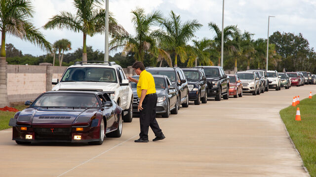Parking Lot Attendant directs Veterans Day Open House Attendees