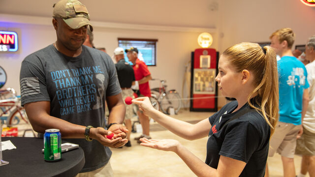 Veteran's Day Open House staff member  interacting with a visitor