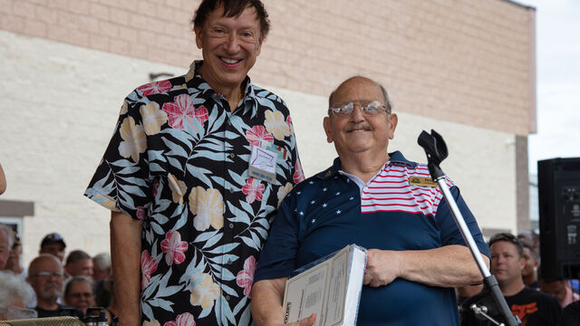 Mark and Pete post for a photo at the Veteran's Day Open House