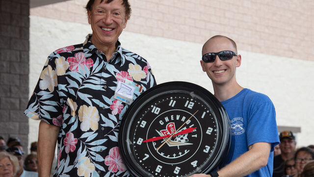 Mark raffles off a Chevrolet clock at the Veteran's Day Open House