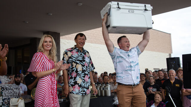 Holding up the cooler he just won at the raffle