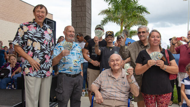 Mark Pieloch poses with some cash winners