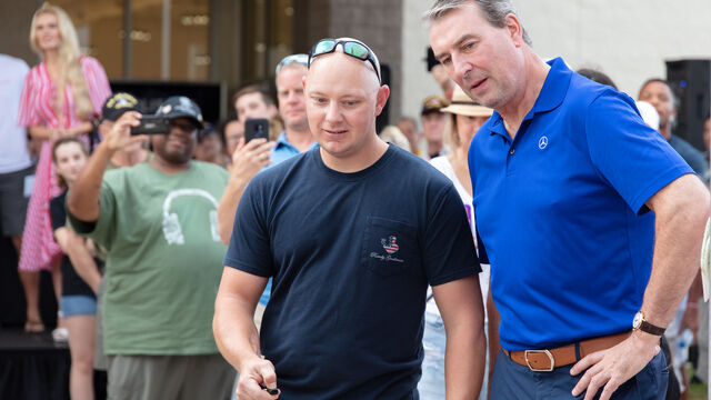 Checking out one of the cars at Veteran's Day Open House