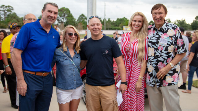 Posing with the red car at the Veteran's Day Open House