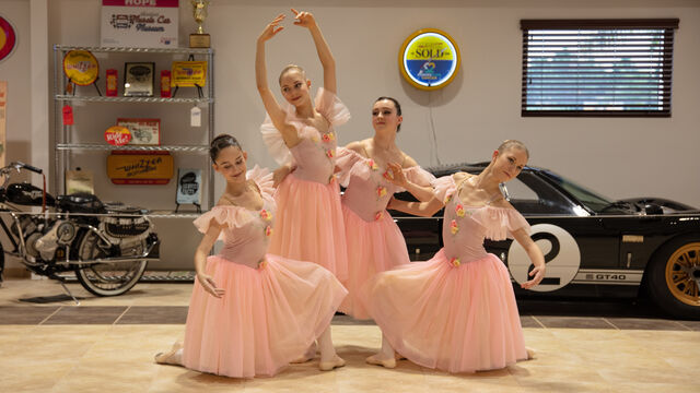 These young ballerinas pose for a photo at Veteran's Day Open House