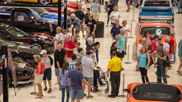 Attendees at the Veteran's Day Open House check out some of the cars on display